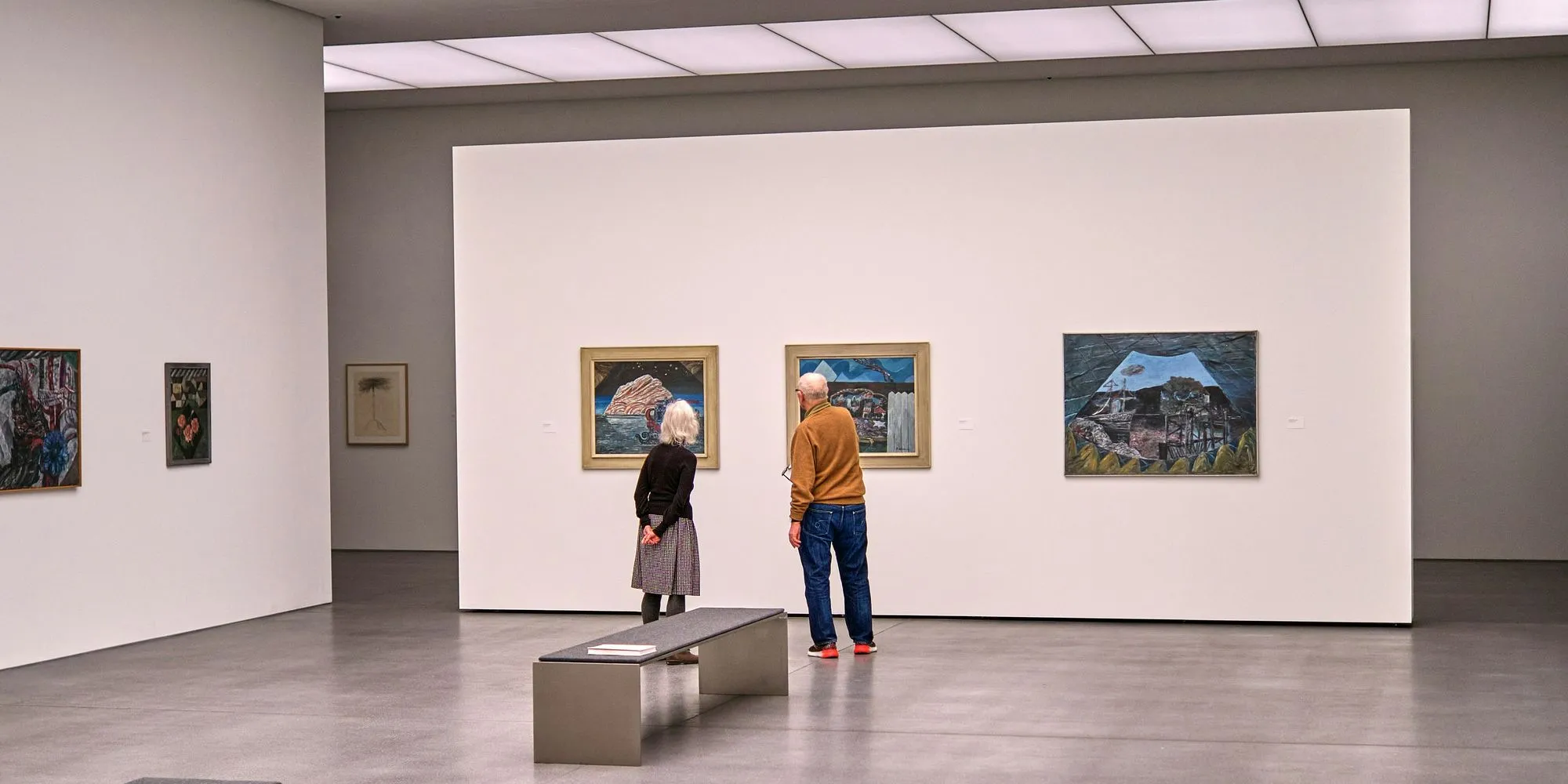 Art gallery interior with artworks on white walls